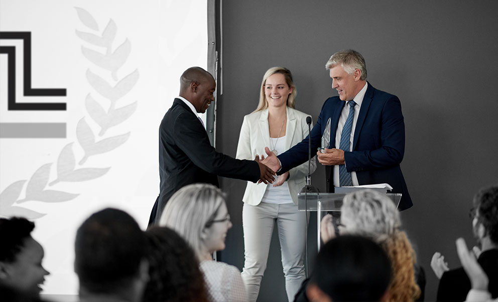 Business person receiving an award at a business conference