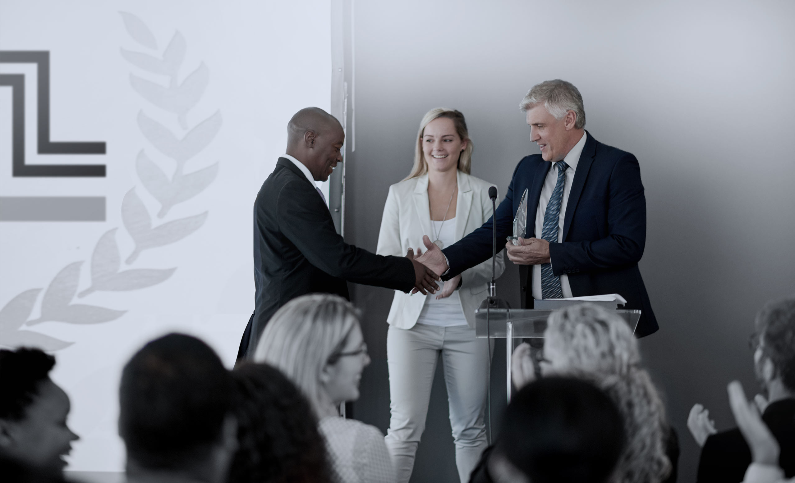 Business person receiving an award at a business conference