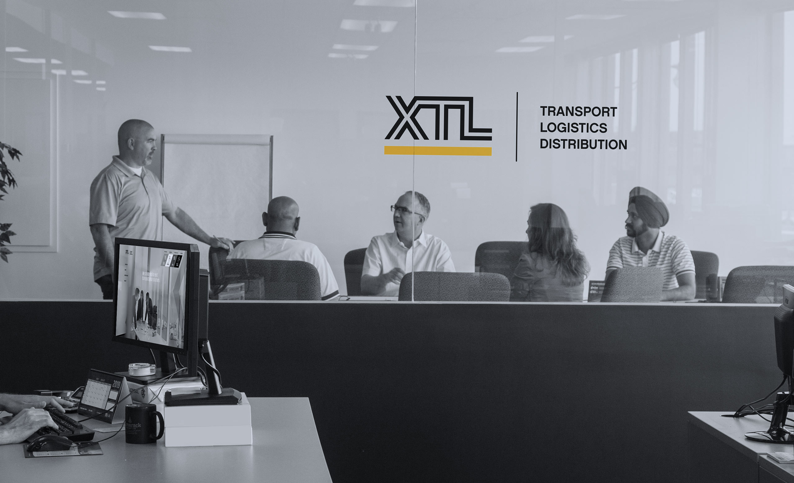 XTL staff meeting in a boardroom